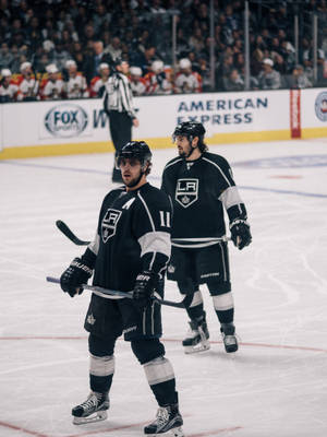 Los Angeles Kings' Stars Anze Kopitar And Drew Doughty In Action Wallpaper