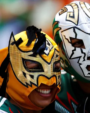 Lucha Libre Fans Smiling Masks Wallpaper