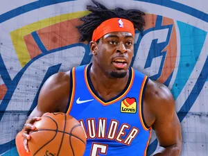 Luguentz Dort With Oklahoma City Thunder Logo Wallpaper