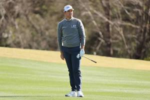 Luke List Standing On Golf Course Wallpaper