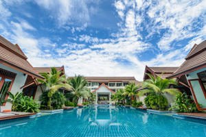 Lush Hotel With Pool Wallpaper