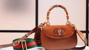 Luxury Redefined - A Brown Leather Gucci Bag In 4k Resolution Wallpaper