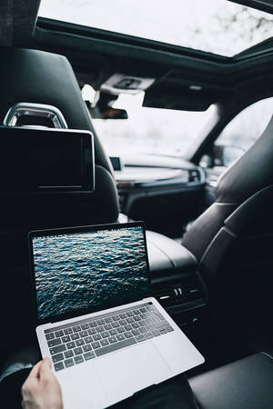 Macbook Air 2020 In A Car Wallpaper