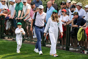 Mackenzie Hughes Taking A Peaceful Walk With His Family Wallpaper