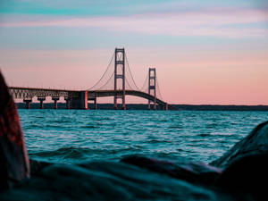 Mackinac Bridge During Soft Sunrise Wallpaper