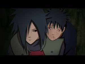 Madara Uchiha Carrying An Uchiha Wallpaper