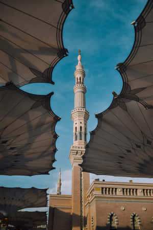 Madina Mosque Minaret Under Umbrellas Wallpaper