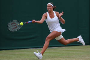 Madison Keys Leaping For Ball Wallpaper