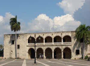 Majestic Architecture Of Alcazar De Colon In The Heart Of Santo Domingo Wallpaper
