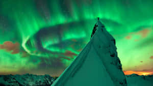 Majestic Aurora Borealis Lighting Up The Night Sky Wallpaper