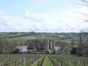 Majestic Bodiam Castle In England Reflecting Off The Moat Wallpaper