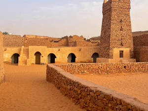 Majestic Chinguetti Mosque In Mauritania During Daytime Wallpaper