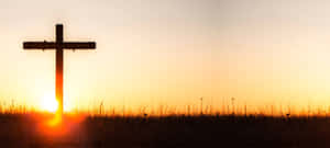 Majestic Cool Cross In A Serene Landscape Wallpaper