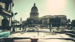 Majestic El Capitolio Standing Tall In The Heart Of Havana Wallpaper