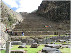 Majestic Landscape Of Ollantaytambo In Peru Wallpaper