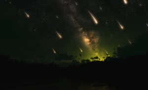 Majestic Meteor Shower In Night Sky Wallpaper