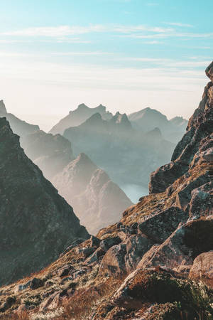 Majestic Mountain Range Rising Into The Sky Wallpaper