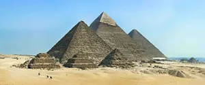 Majestic Pyramids Of Giza Basking Under The Egyptian Sun Wallpaper
