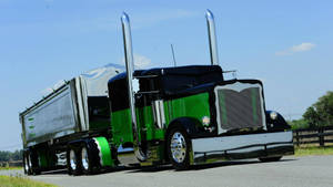 Majestic Silver-green Truck Amidst Nature Wallpaper