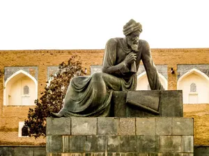 Majestic Statue Overlooking Ancient City Of Khiva Wallpaper