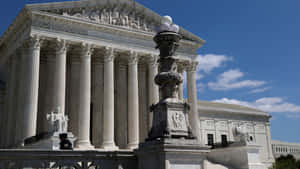 Majestic Supreme Court Building Under The Bright Sky Wallpaper