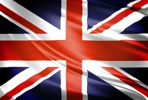 Majestic United Kingdom Flag In A Dark Setting Wallpaper