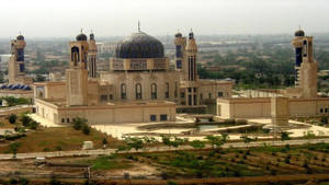Majestic View Of A Historic Mosque In Baghdad Wallpaper