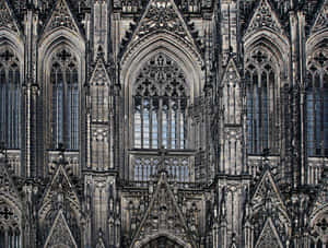 Majestic View Of Cologne Cathedral With Gothic Architecture Wallpaper