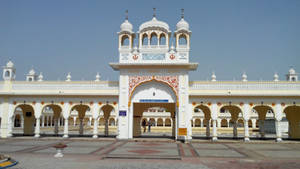 Majestic View Of Nankana Sahib Gate In Lahore Wallpaper