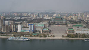 Majestic View Of Pyongyang Skyline Under The Blue Sky Wallpaper