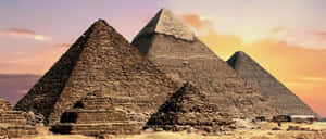 Majestic View Of The Ancient Giza Pyramids In Egypt Wallpaper