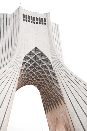 Majestic View Of The Azadi Tower Against The White Sky Wallpaper