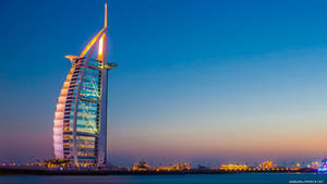 Majestic View Of The Luxurious Burj Al Arab Hotel In Dubai. Wallpaper