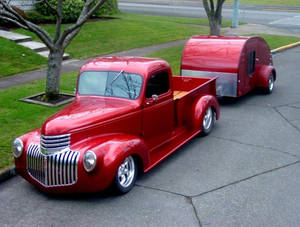 Majestic Vintage Ford Truck In Metallic Red Wallpaper