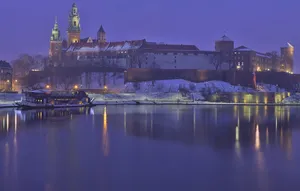Majestic Wawel Castle On A Crisp Winter Evening Wallpaper