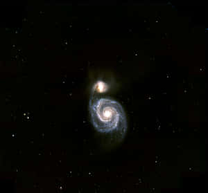 Majestic Whirlpool Galaxy Spiral In Deep Space Wallpaper