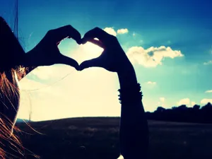 Making A Heart Sign For Girls Wallpaper