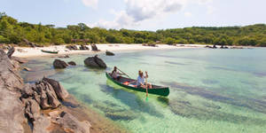 Malawi Men Rowing Boat Wallpaper