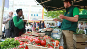 Man Buying From Local Market Stand Wallpaper