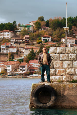 Man By The Bay In North Macedonia Wallpaper