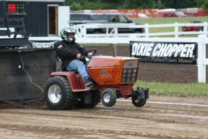 Man Driving Dark-orange Pull Tractor Wallpaper