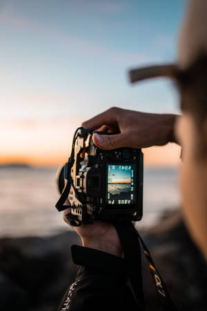 Man Holding Black Camera Photography Wallpaper