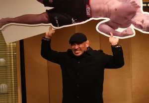 Man Holding Cutoutof Fighter Wallpaper