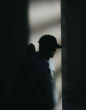 Man In Cap In The Darkness Wallpaper