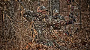 Man In Hunting Camo On Dried Leaves Wallpaper