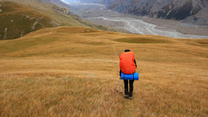 Man In Kyrgyzstan Mountains Wallpaper