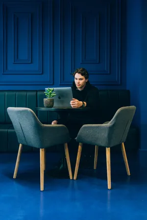 Man In Navy Blue Room Wallpaper