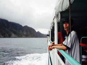 Man On Sailing Ferry Boat Wallpaper