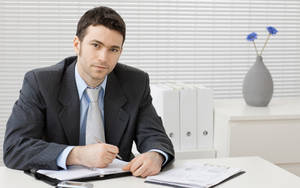 Man Sitting On A Chair Wallpaper