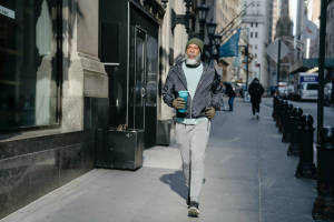 Man Walking On Pavement Morning City Wallpaper